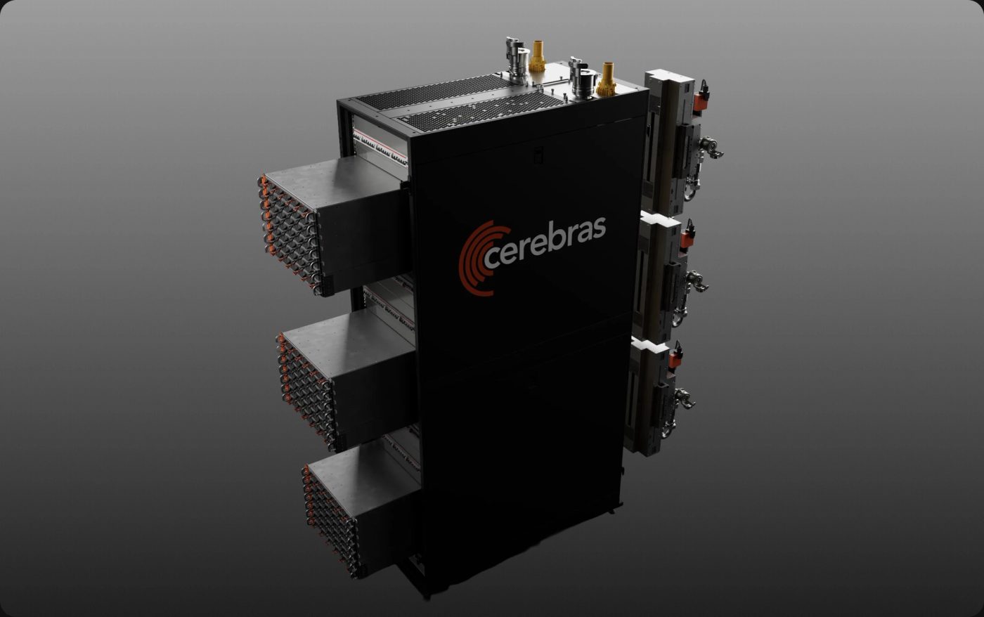 Product render of the Cerebras CS-4 rack on a grey studio background, a black cabinet with the Cerebras logo and three horizontal Wafer-Scale Backpack modules slid partway out of the left side, each showing dense rows of orange-tipped connectors, with power and liquid cooling hardware on the right.