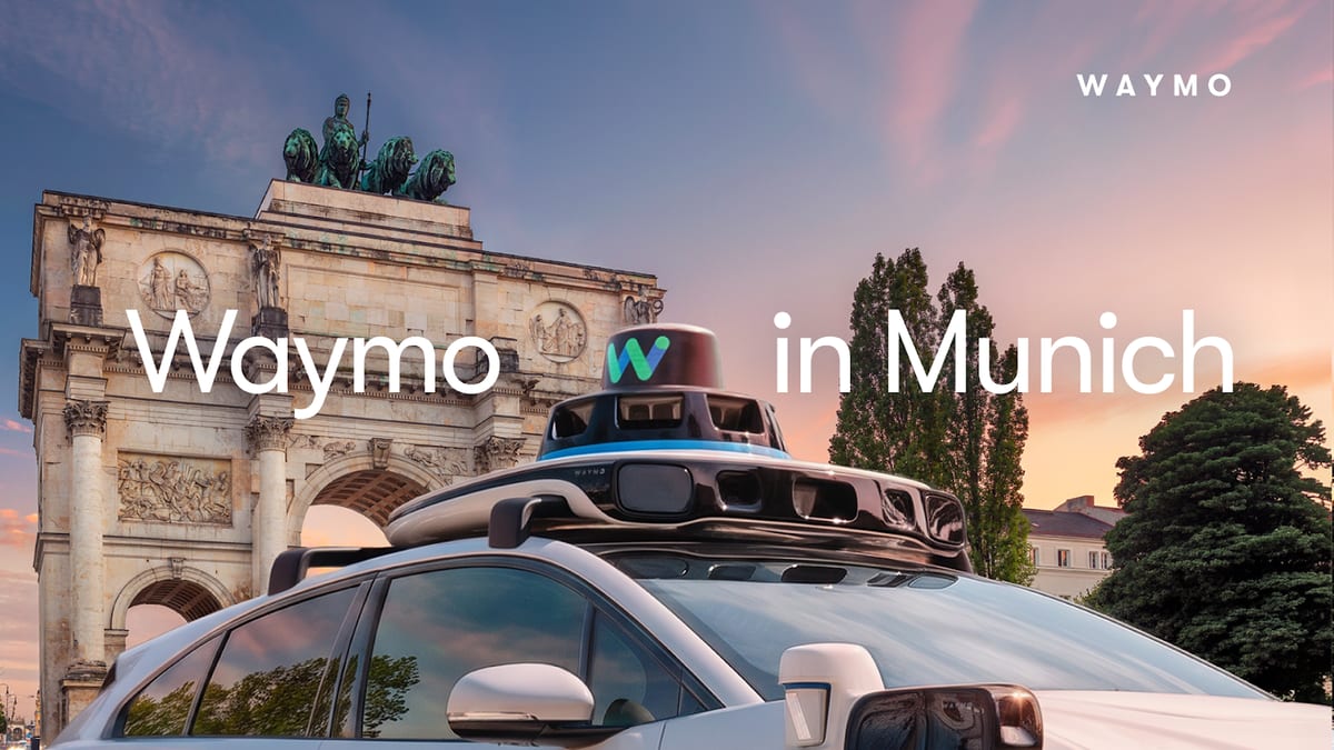 Official Waymo announcement image of a white Jaguar I-PACE with a roof mounted sensor dome parked in front of the Siegestor arch in Munich at sunset, with the caption Waymo in Munich.